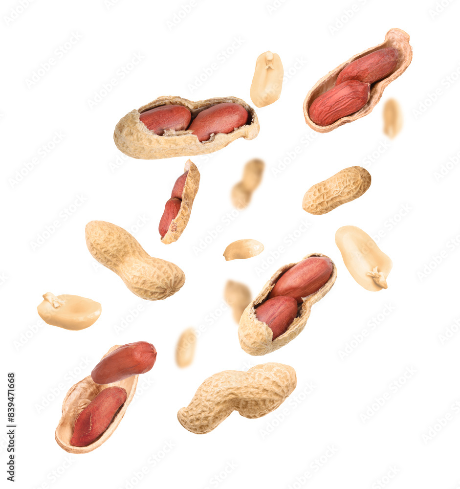 Unpeeled peanuts in air on white background Unpeeled peanuts in air on white background