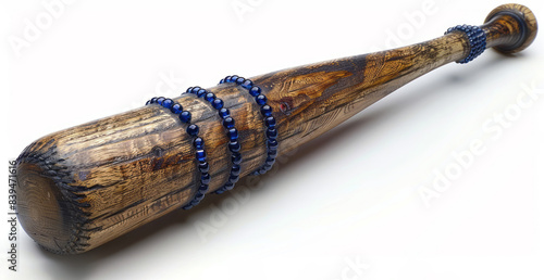 A baseball bat with a blue beaded handle is isolated on a white backdrop, shown in detail. photo