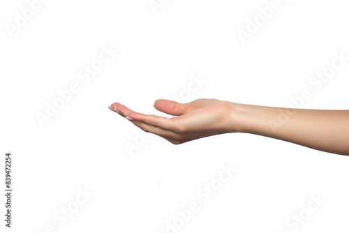 A woman's hand is open, palm up, to take or give something. Gesture isolated on white background. The girl is holding or passing an object. Product presentation concept or mockup with copy space