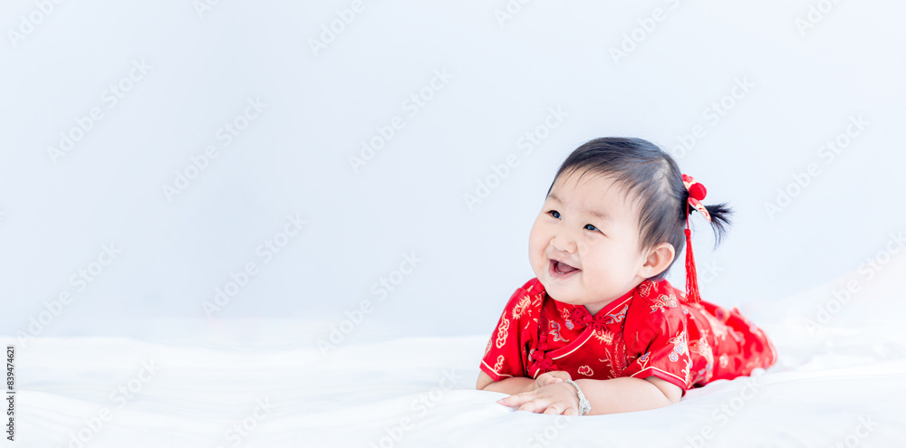 Girl in Chinese New Year costume,Happy Little asian girl in chinese traditional dress laughing and smiling. Girl in Chinese New Year costume,Happy Little asian girl in chinese traditional dress laughing and smiling.