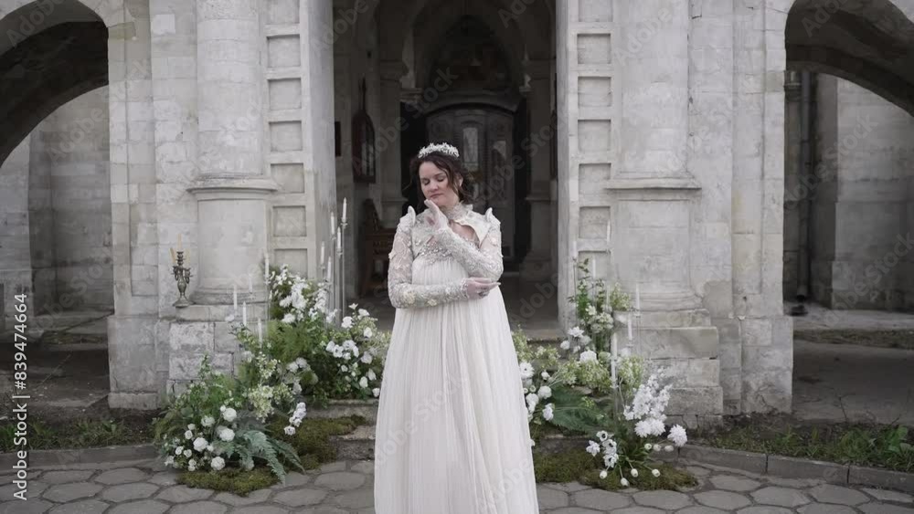 A bride in a Gothic gown is marrying at a Stone Castle, a beautiful and romantic setting A bride in a Gothic gown is marrying at a Stone Castle, a beautiful and romantic setting