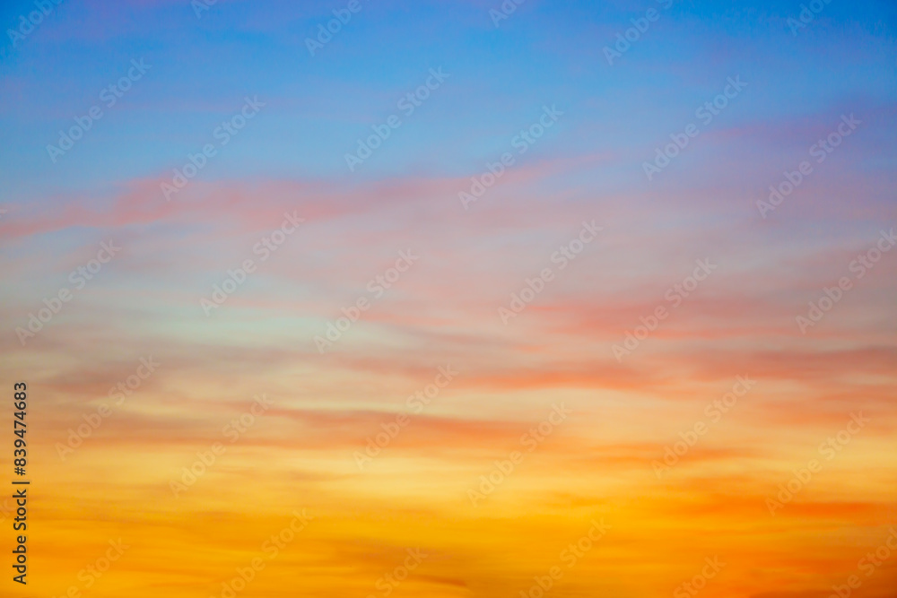 Fototapeta premium Clouds and sky in the evening,Real majestic sunrise sundown sky background with gentle colorful clouds without birds. Panoramic, big size