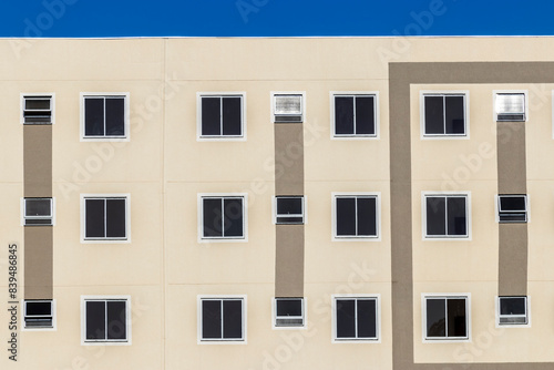 Facade with windows of a lower middle class residential building in Brazil
