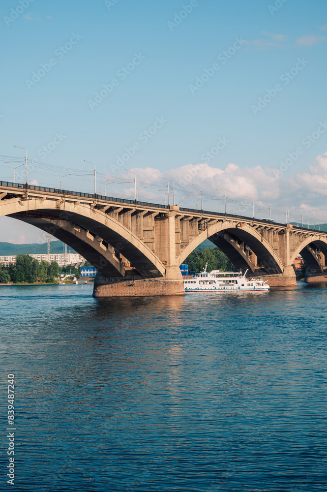 Communal bridge over the Yenisei River at beauty sunny summer day in Krasnoyarsk city. Communal bridge over the Yenisei River at beauty sunny summer day in Krasnoyarsk city.