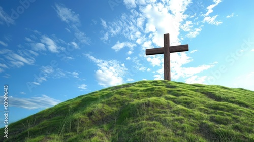 Simple wooden cross of Christ on a grassy hill, with a bright, clear blue sky above, representing faith and simplicity