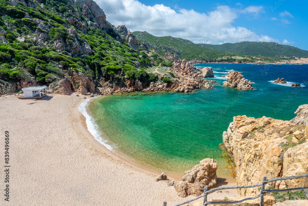 View of Cala Li Cossi sandy beach, scenic cove in the mediterranean coast and sea with beautiful rocks in clear water in Costa Paradiso, Sardinia landscape View of Cala Li Cossi sandy beach, scenic cove in the mediterranean coast and sea with beautiful rocks in clear water in Costa Paradiso, Sardinia landscape