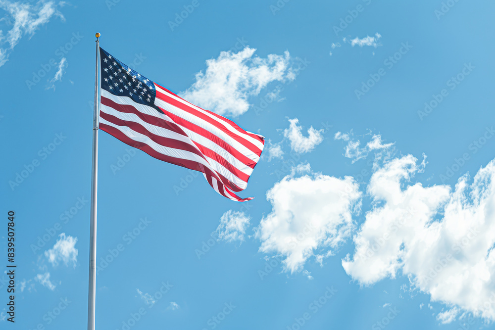 A red and white American flag is flying high in the sky A red and white American flag is flying high in the sky