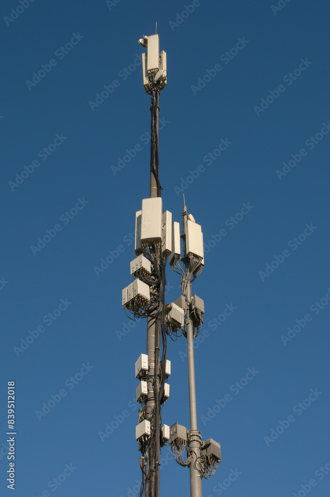 Telecommunication tower of 4G and 5G cellular on blue sky background Telecommunication tower of 4G and 5G cellular on blue sky background