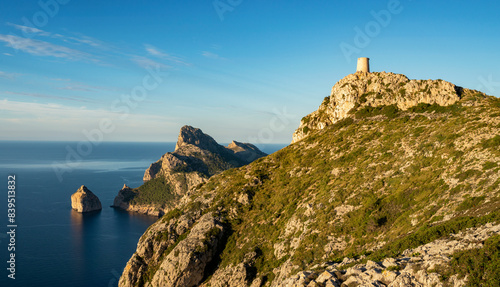 Panoramic view of Talaia de Albercutx watch tower and the coastline cliffs of Cap de Formentor cape, Majorca, Balearic Islands, Spain photo