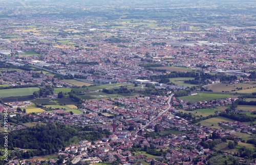 Bird-eye view of a sprawling urban landscape with numerous houses buildings and factories