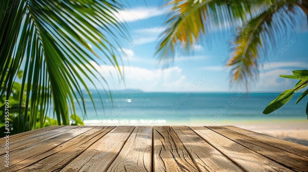 Empty wood table over blue sea, beach and palm leaves background in summer day. Empty wood table over blue sea, beach and palm leaves background in summer day.
