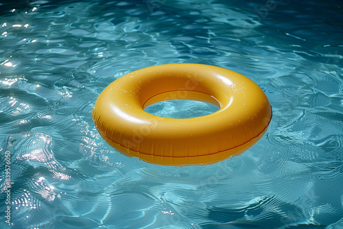 Yellow Inflatable Ring Floating in a Pool of Water