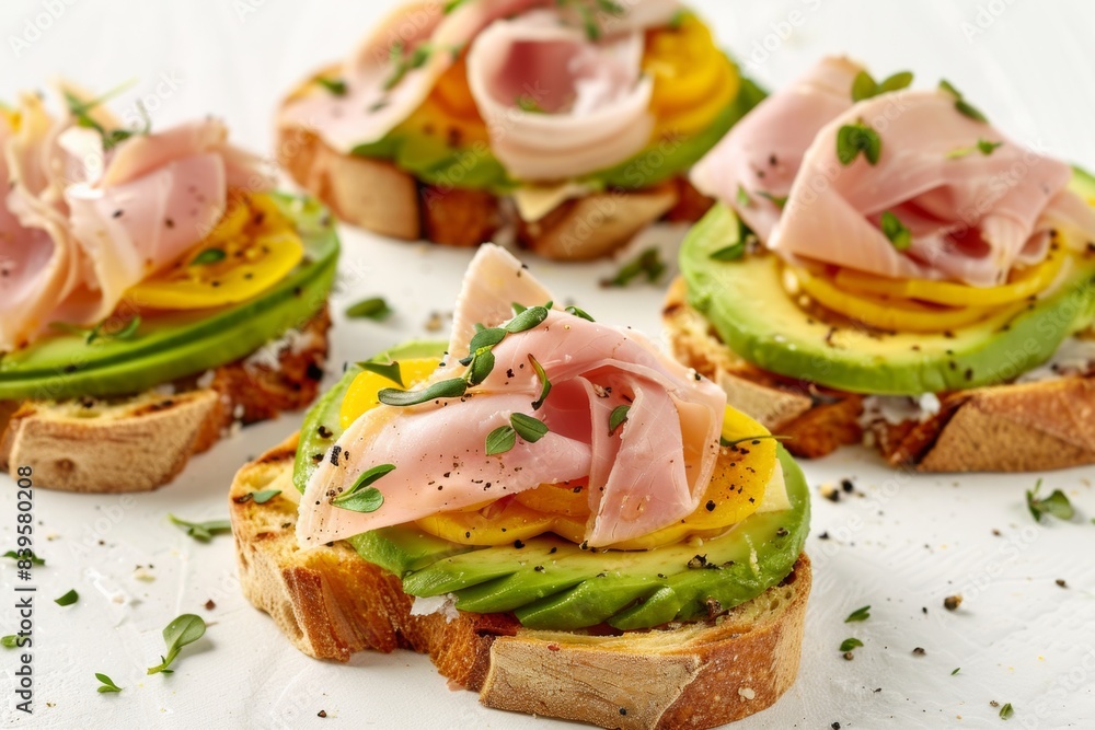 Avocado toast with prosciutto and herbs on white background Avocado toast with prosciutto and herbs on white background
