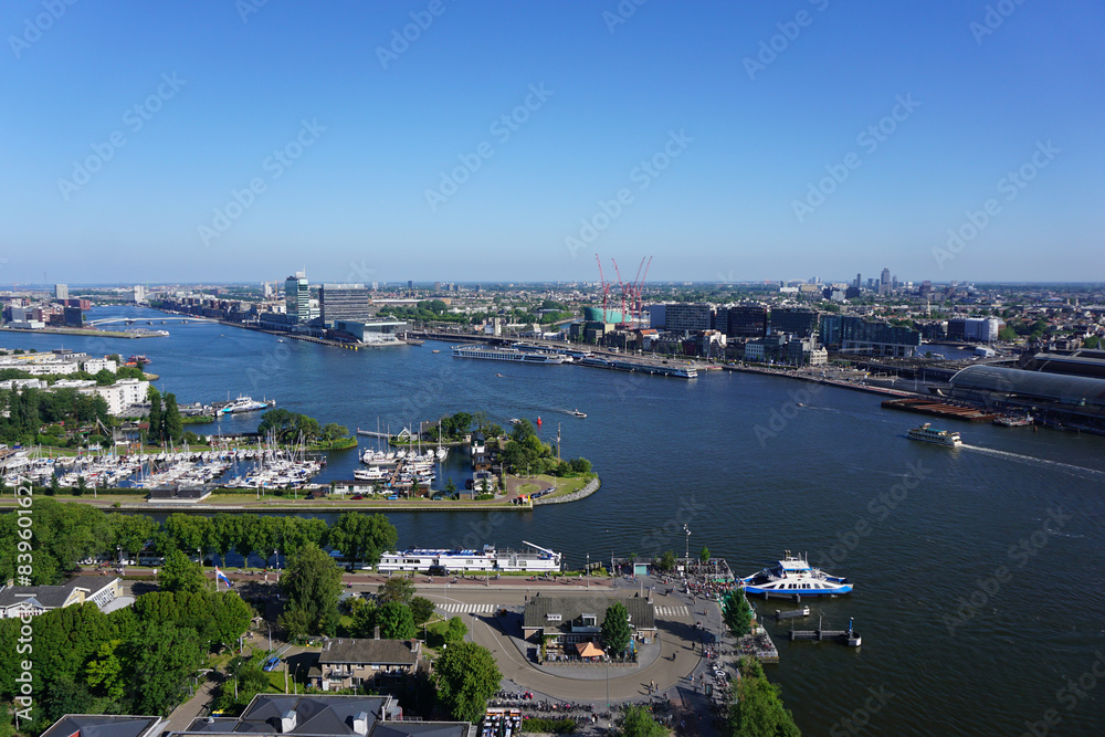 Fototapeta premium High angle view of river and buildings against clear blue sky