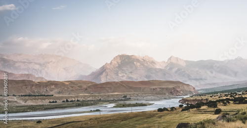 Panoramic mountain landscape in the mountains in the evening at sunset for background in the mountains of Tajikistan, the texture of hills and high mountains minimalist in the evening