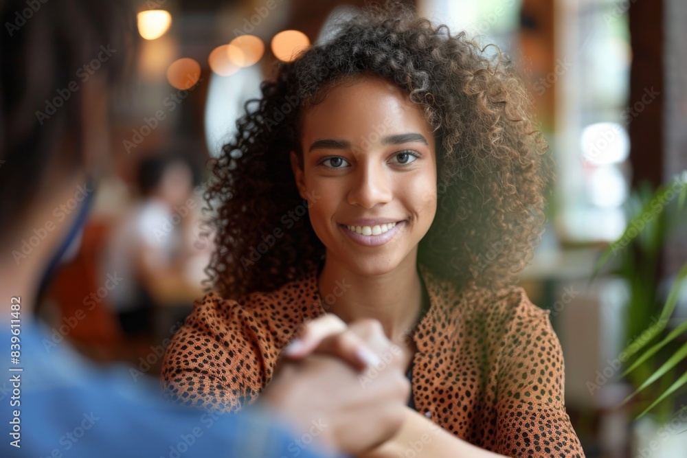 Happy woman, curly hair, man, sitting, table Happy woman, curly hair, man, sitting, table