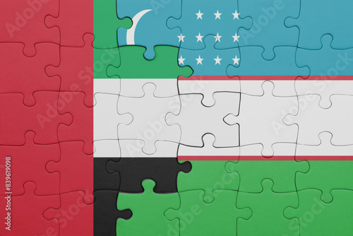 puzzle with the colourful national flag of uzbekistan and flag of united arab emirates .