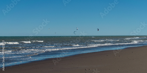 kitesurfing at the seashore on a windy afternoon
