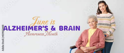 Happy woman with grandmother on grey background