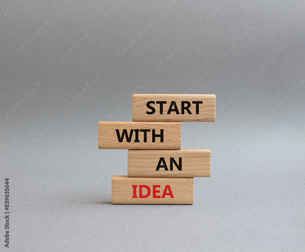Start with an Idea symbol. Wooden blocks with words Start with an Idea. Beautiful grey background. Business and Start with an Idea concept. Copy space. Start with an Idea symbol. Wooden blocks with words Start with an Idea. Beautiful grey background. Business and Start with an Idea concept. Copy space.