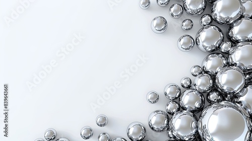 A white background with silver spheres floating in the center, creating an abstract and minimalistic composition.