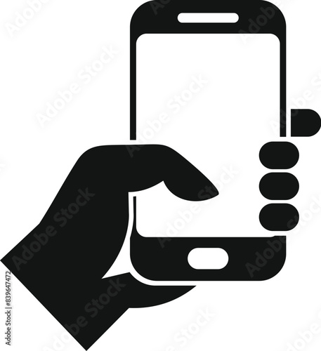 Businessman is holding a smartphone, using his thumb to interact with the touchscreen