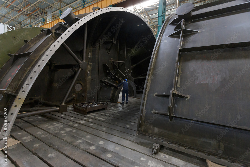 Body parts of a low pressure turbine at factory workshop. Body parts of a low pressure turbine at factory workshop.