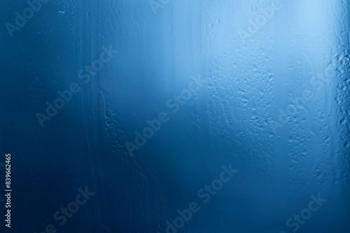 Rain drops on window glasses surface. Natural Pattern of raindrops on clear window.