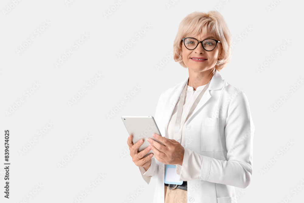 Female doctor with tablet computer on white background Female doctor with tablet computer on white background