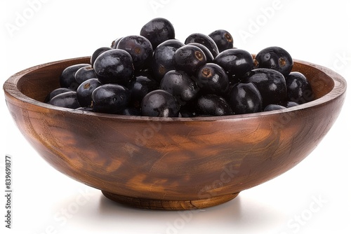 Wallpaper Mural Rustic wooden bowl filled with fresh black grapes on a white background, emphasizing natural beauty and simplicity in healthy living Torontodigital.ca