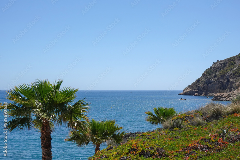 View to Albir coast and blue Mediterranean Sea. Albir is stylish modern seaside resort of L' Alfas del Pi, Alicante province, Spain View to Albir coast and blue Mediterranean Sea. Albir is stylish modern seaside resort of L' Alfas del Pi, Alicante province, Spain