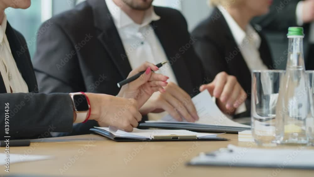 Close up man hands with papers in office. Group meeting of businessman people in office. Company meeting for brainstorm in big office. Ceo listenin employees for new projects. Close up man hands with papers in office. Group meeting of businessman people in office. Company meeting for brainstorm in big office. Ceo listenin employees for new projects.