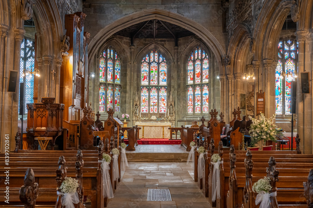 Fototapeta premium Inside of a church looking up the aisle