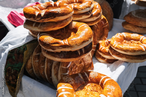 traditional Asian bread kazakh tandoor flatbread on counter at the bazaar in Kazakhstan photo