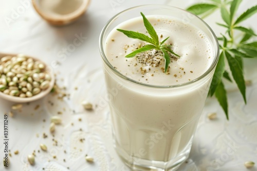 Closeup of glass with hemp milk on light background