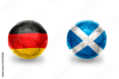 football balls with national flags of germany and scotland ,soccer teams. on the white background. photo
