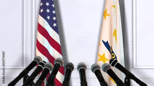 Rhode Island and USA Flags with Microphones. Official Press Conference of States of America Government photo