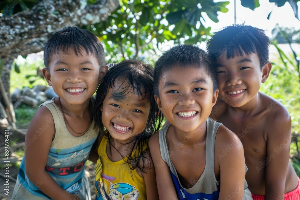 Portrait of a group of Asian children smiling in the garden. Portrait of a group of Asian children smiling in the garden.