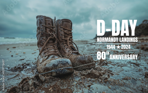 Vintage military boots on normandy beach, a tribute on the 80th anniversary of D-day landings © bluebeat76