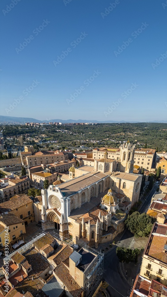 Fototapeta premium cathedral and cozy streets with ancient architecture of coastal town Tarragona, Spain, aerial drone view