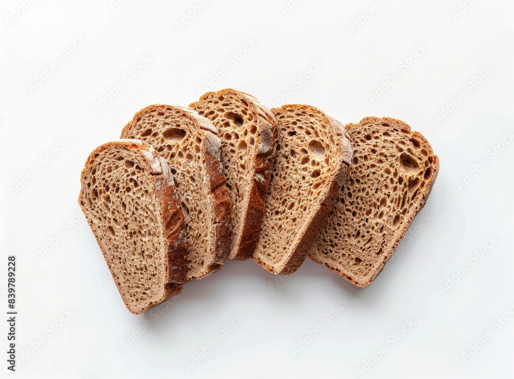 Sliced whole wheat bread isolated on a white background, shown from above. Flat lay