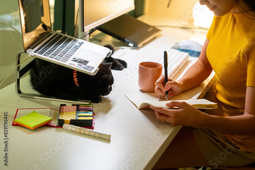 Asian woman freelance working on laptop computer with using AI searching data at night. Businesswoman remote working online corporate business financial at home. Modern life and technology concept.