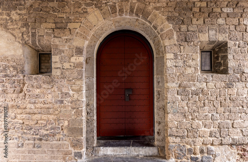 Wallpaper Mural red door with merallic inserts in an old stone castle
 Torontodigital.ca