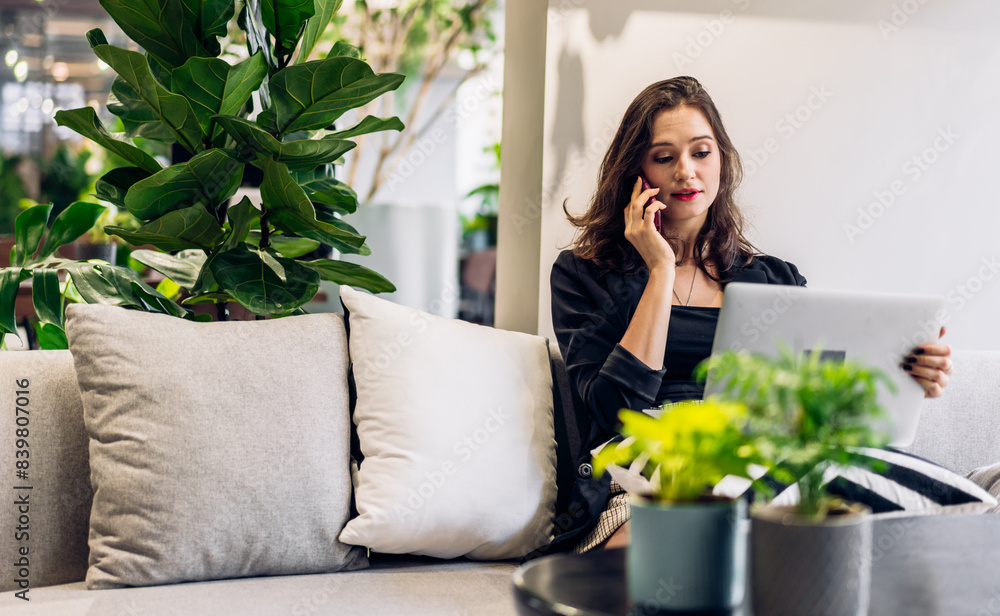 Portrait of smiling happy beautiful woman relax work and looking at technology of laptop computer sitting on chair.Young hipster girl freelancer business thinking with new idea content in green office Portrait of smiling happy beautiful woman relax work and looking at technology of laptop computer sitting on chair.Young hipster girl freelancer business thinking with new idea content in green office