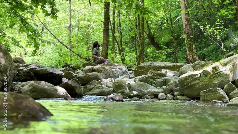 wonderful forest nature riverside lake in Hyrcanian Azerbaijan tourism attraction man sit on huge big rock stone meditation yoga calmness stream tree water surface wide view panoramic natural iran wonderful forest nature riverside lake in Hyrcanian Azerbaijan tourism attraction man sit on huge big rock stone meditation yoga calmness stream tree water surface wide view panoramic natural iran