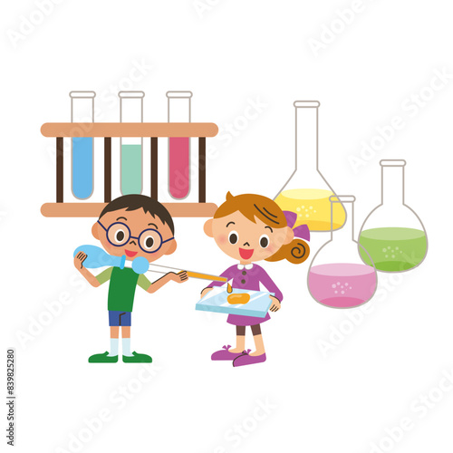 試験管で化学の実験をしている子供達