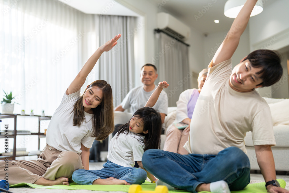 Portrait of happy love asian fit strength family mother with little asian girl training sitting relax and practicing yoga, fitness, exercise, wellness, workout, sport at home.Diet.Fitness, healthy Portrait of happy love asian fit strength family mother with little asian girl training sitting relax and practicing yoga, fitness, exercise, wellness, workout, sport at home.Diet.Fitness, healthy