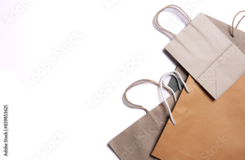 Kraft paper eco bag, top view and flat lay. Brown and white Kraft package on white background