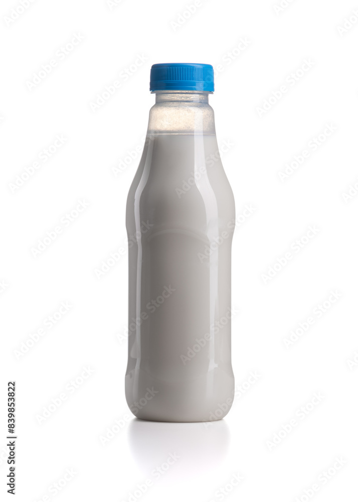 Plastic milk bottle with blue lid isolated on a white background. Plastic milk bottle with blue lid isolated on a white background.
