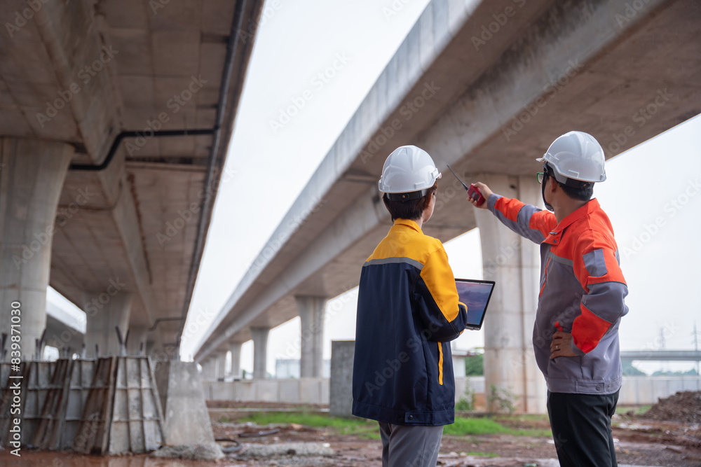 Asian engineering team conducting an inspection at a highway construction site, evaluating the quality of the concrete road and ensuring compliance with standards. Asian engineering team conducting an inspection at a highway construction site, evaluating the quality of the concrete road and ensuring compliance with standards.